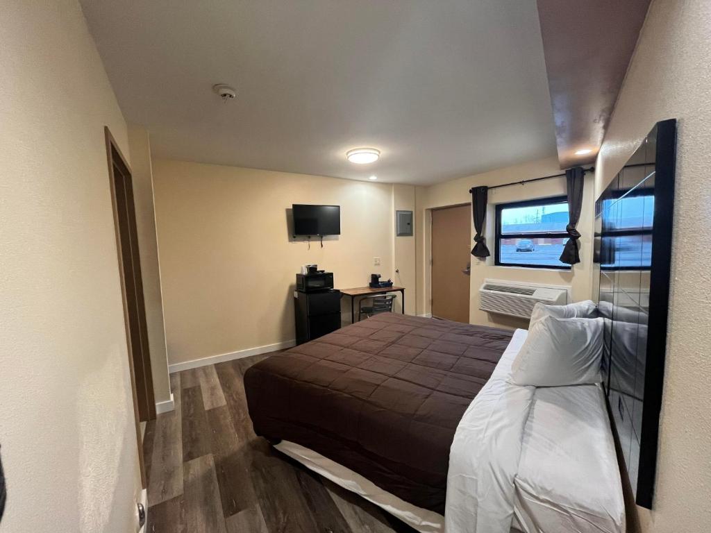 Postel nebo postele na pokoji v ubytování Circle Motor Lodge