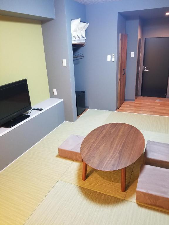 TV a/nebo společenská místnost v ubytování Hotel Eco Dogo