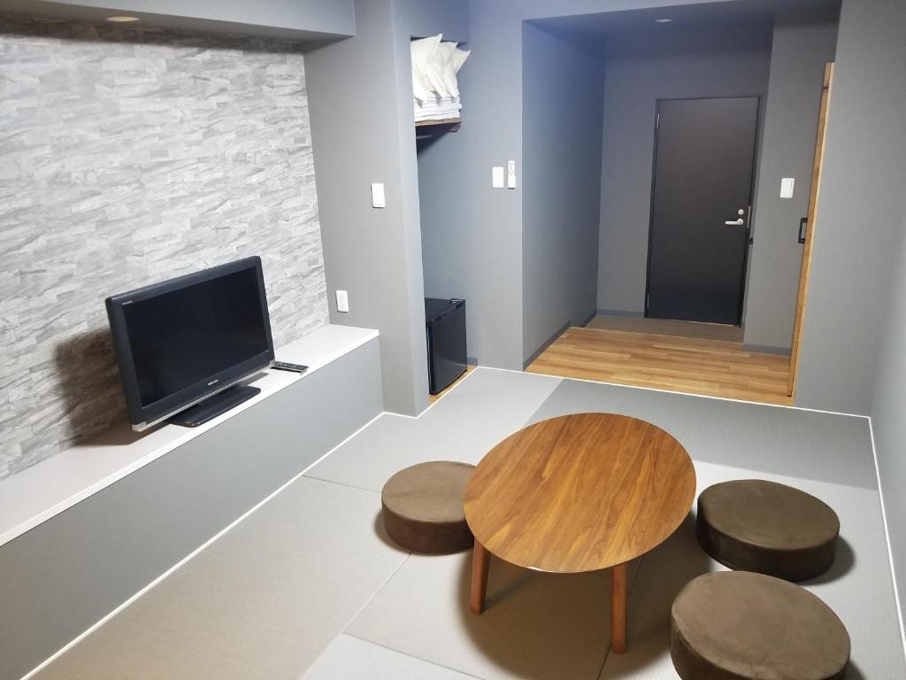 TV a/nebo společenská místnost v ubytování Hotel Eco Dogo