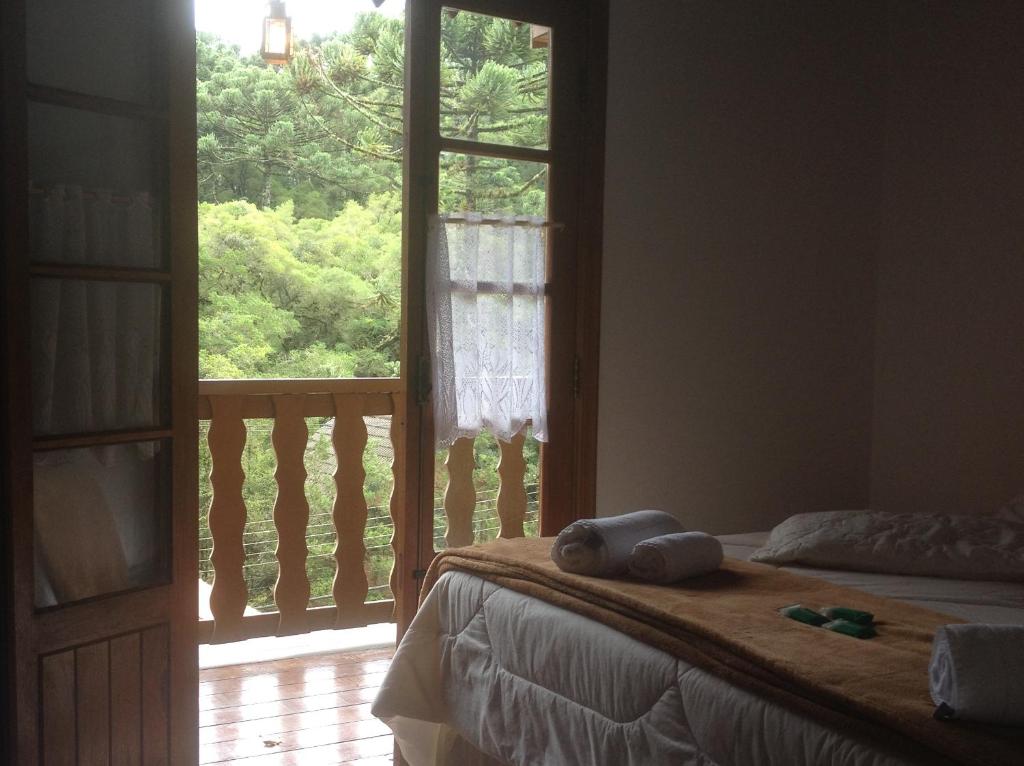 Katil atau katil-katil dalam bilik di Pousada Sonho Verde
