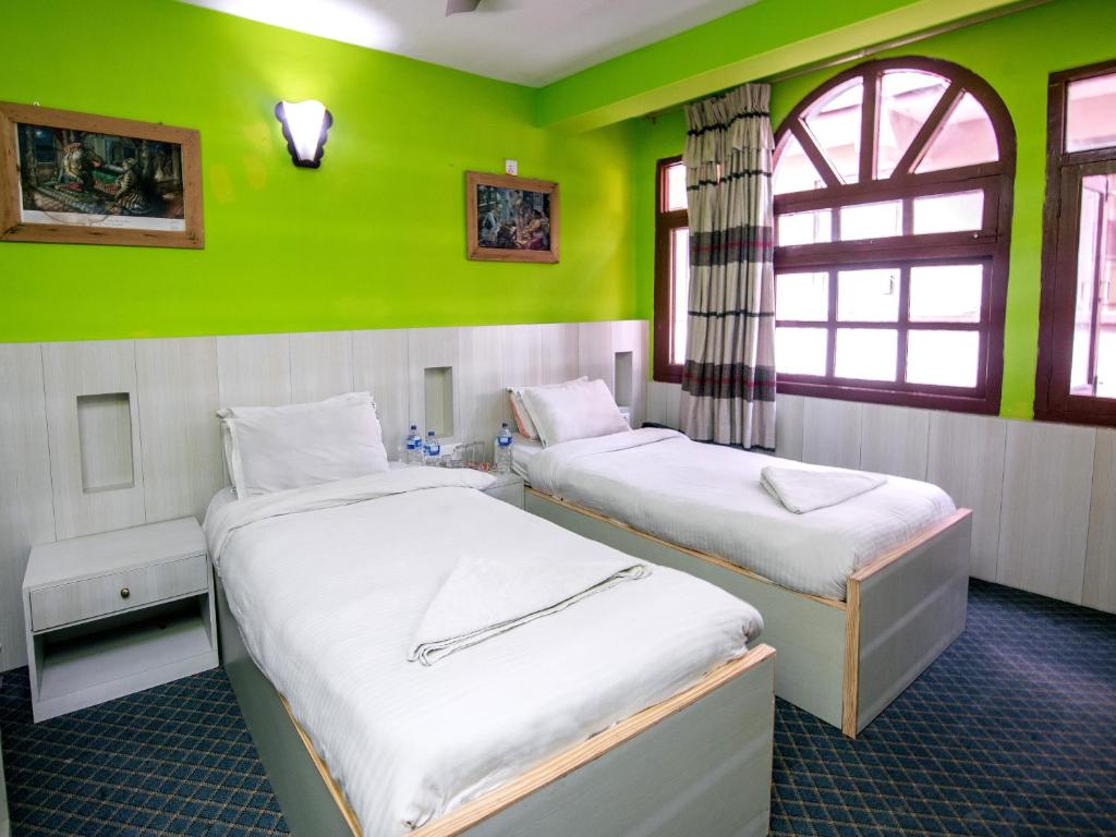 Postel nebo postele na pokoji v ubytování Hotel Pomelo House