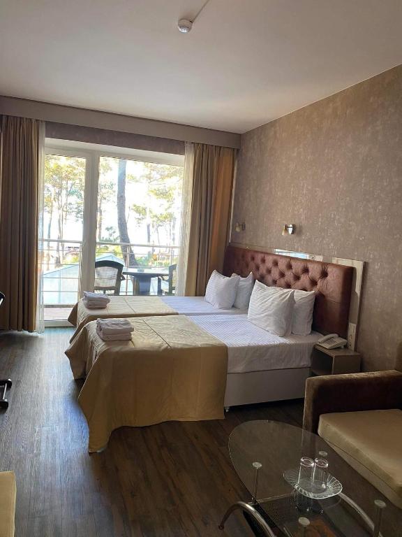 Postel nebo postele na pokoji v ubytování Villa ReTa Hotel & SPA