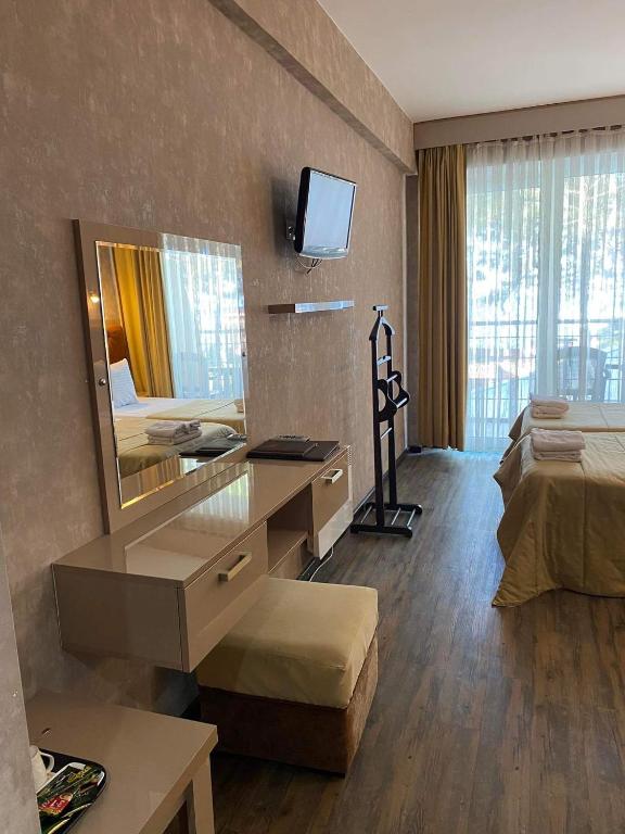 Postel nebo postele na pokoji v ubytování Villa ReTa Hotel & SPA