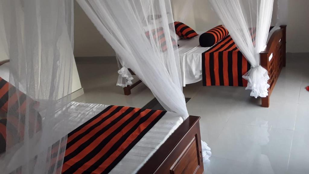 Postel nebo postele na pokoji v ubytování Baagie Homestay