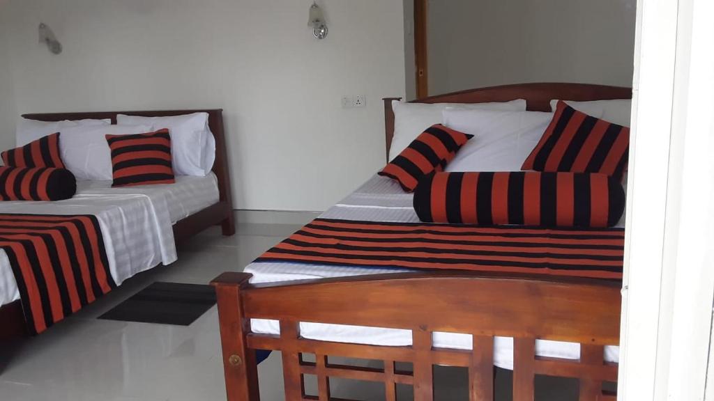Postel nebo postele na pokoji v ubytování Baagie Homestay