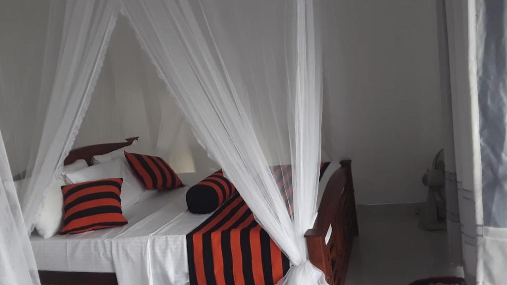 Postel nebo postele na pokoji v ubytování Baagie Homestay