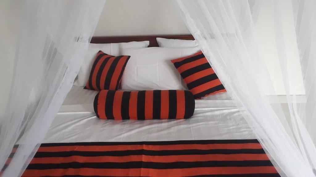 Postel nebo postele na pokoji v ubytování Baagie Homestay