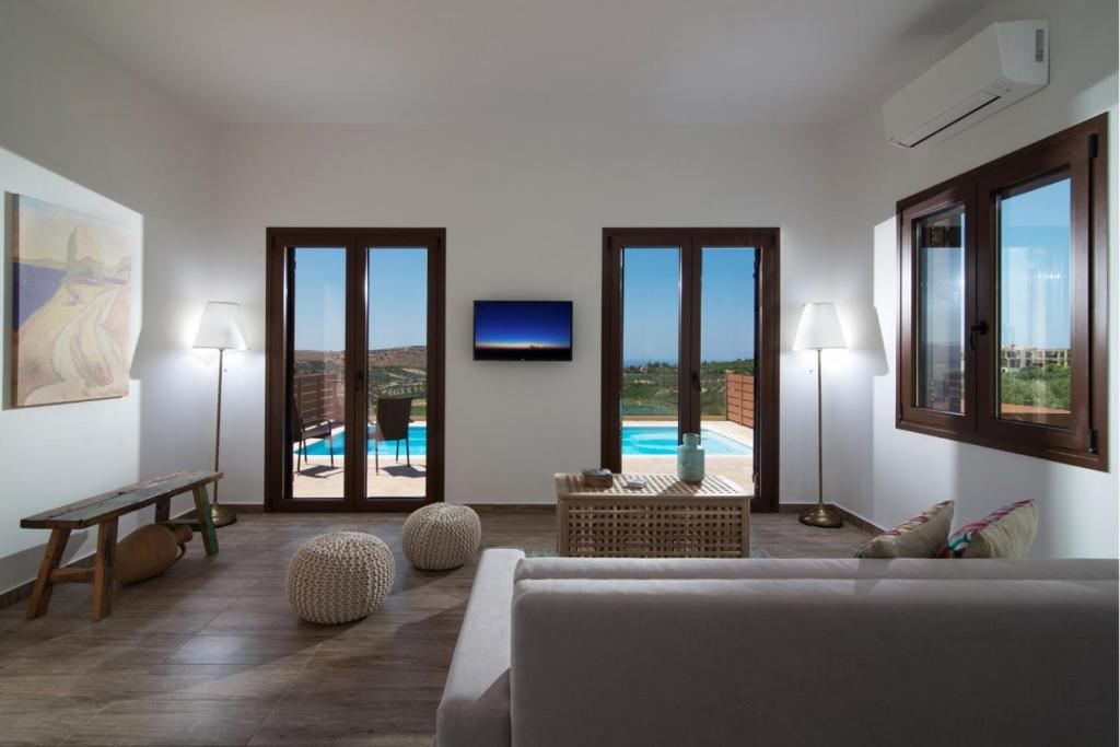 A television and/or entertainment centre at Stylish Villa Liatiko - Heated pool - Amazing views