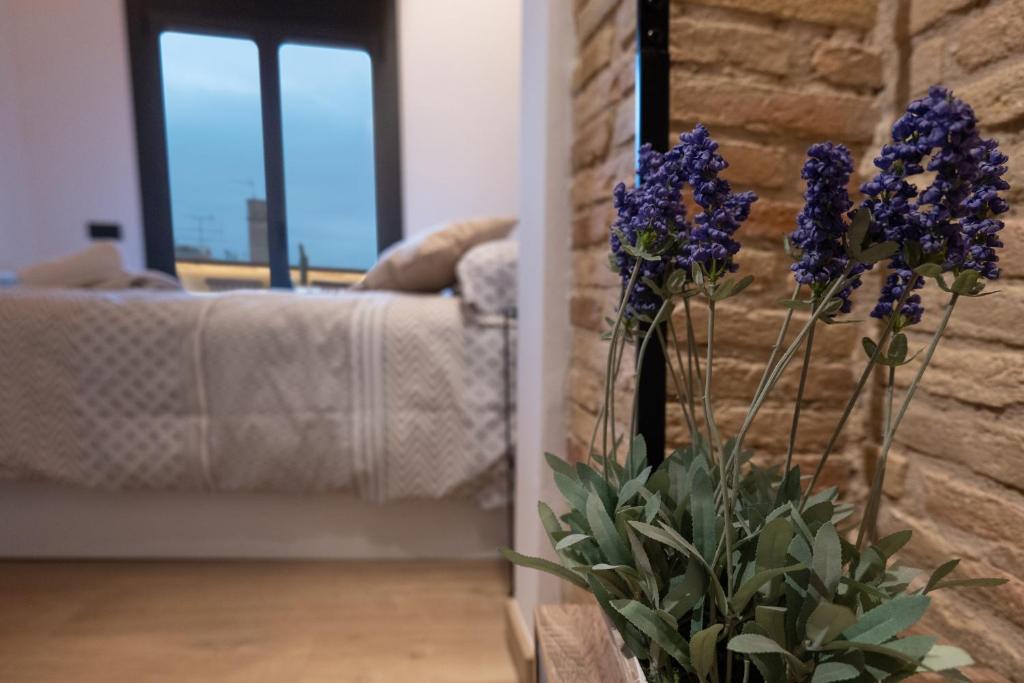 Postel nebo postele na pokoji v ubytování Niu del Sol