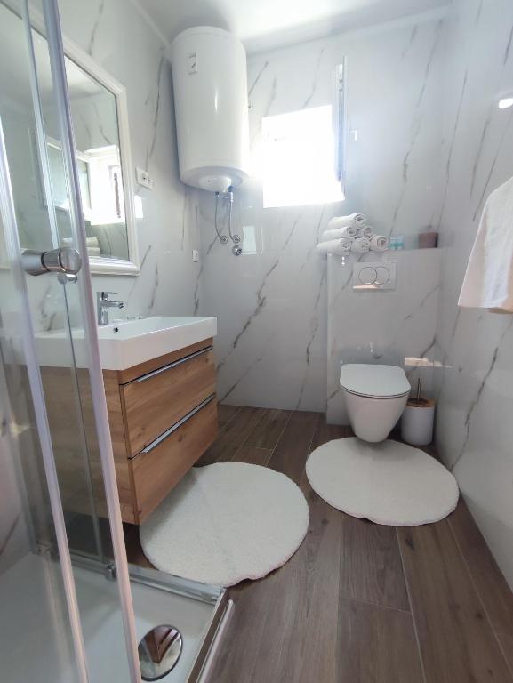 Koupelna v ubytování Apartments Laus