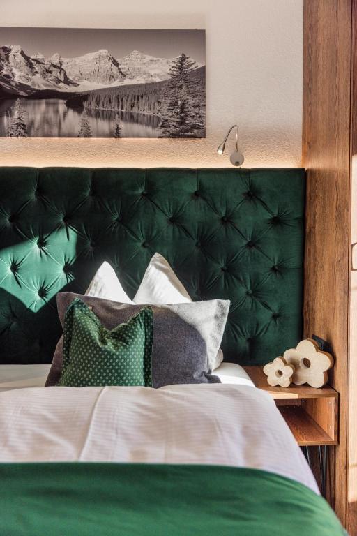 Postel nebo postele na pokoji v ubytování Vitalhotel Kaiserhof