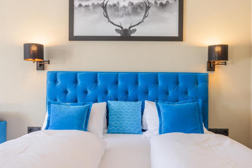 Postel nebo postele na pokoji v ubytování Vitalhotel Kaiserhof