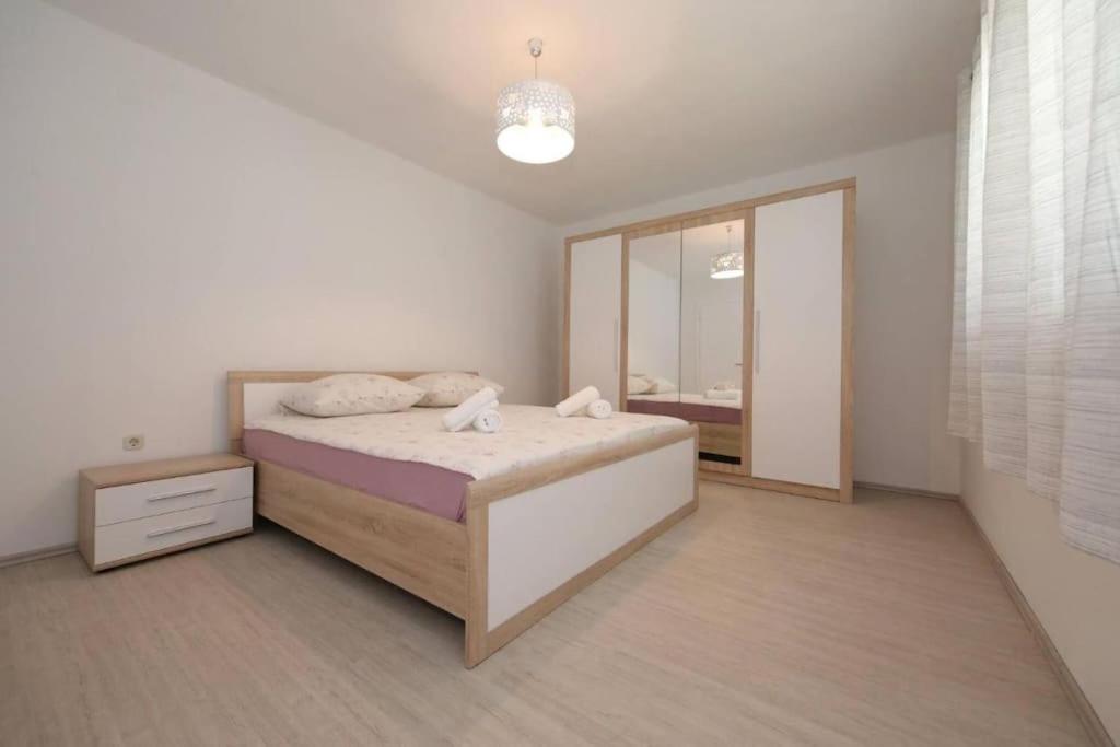 Postel nebo postele na pokoji v ubytování Modern House Giulia