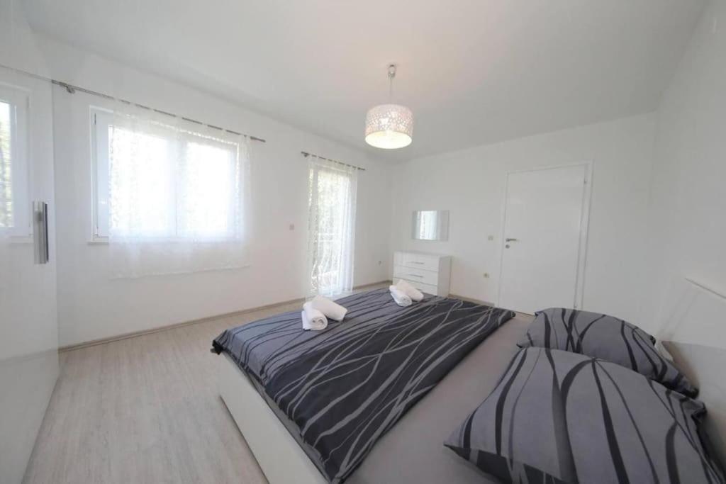 Postel nebo postele na pokoji v ubytování Modern House Giulia