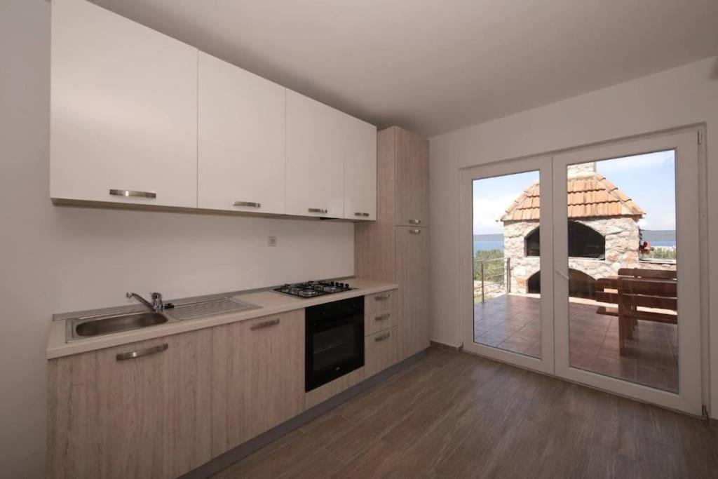 Kuchyň nebo kuchyňský kout v ubytování Modern House Giulia