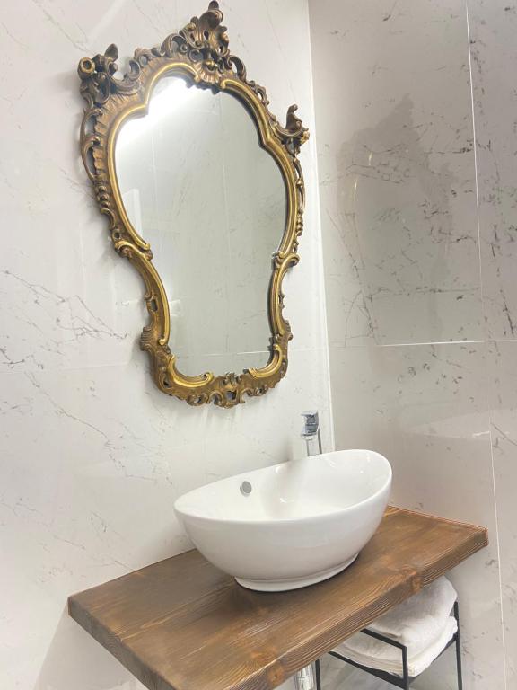 a bathroom with a white sink and a mirror at prova annuncio in Oristano