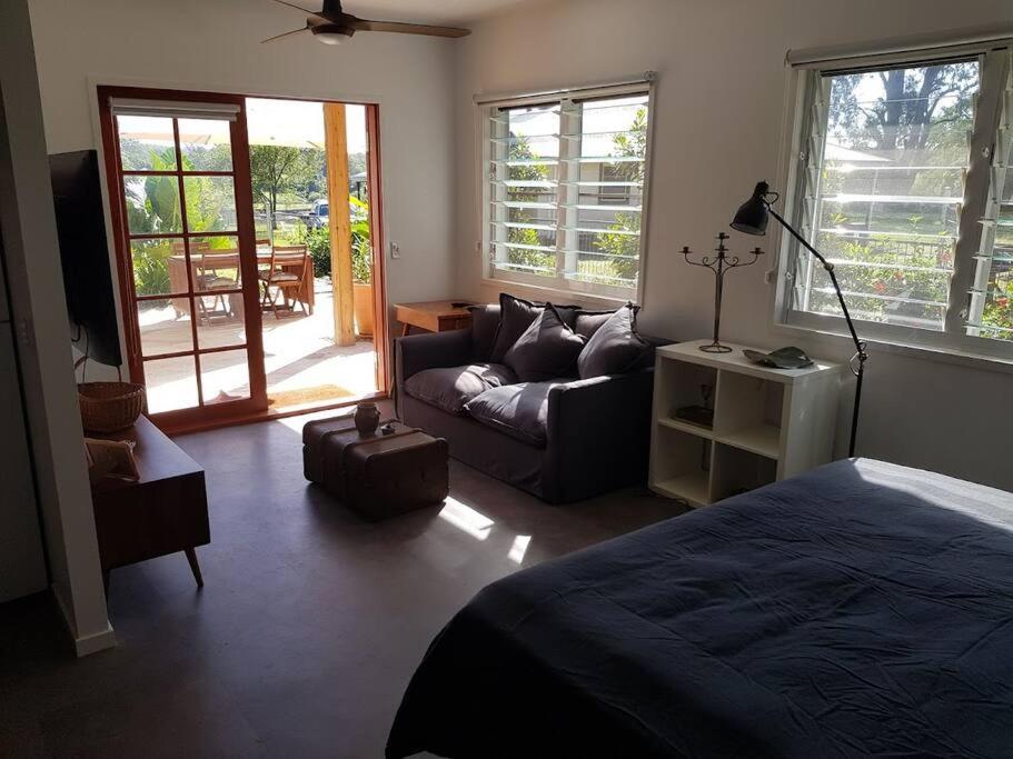 a living room with a bed and a couch at Riverstay on Clarence in Seelands