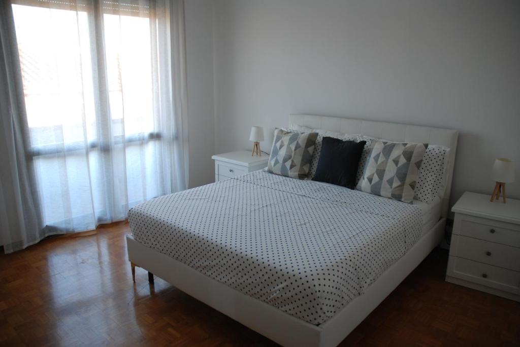 A bed or beds in a room at Appartamento Vera