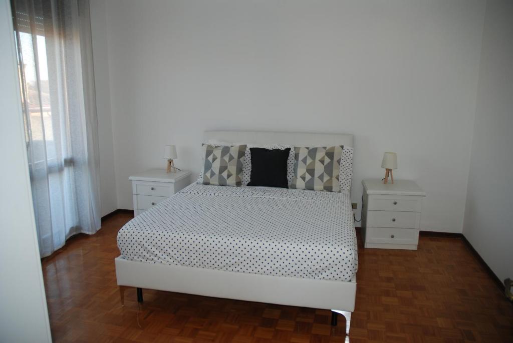 A bed or beds in a room at Appartamento Vera