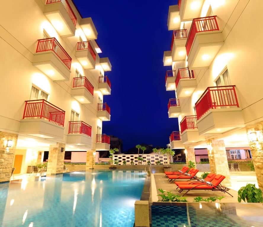 a hotel with a swimming pool at night at Lombok Plaza Hotel and Convention in Mataram