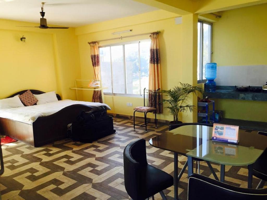 Letto o letti in una camera di Hello Inn Guest House & Apartment