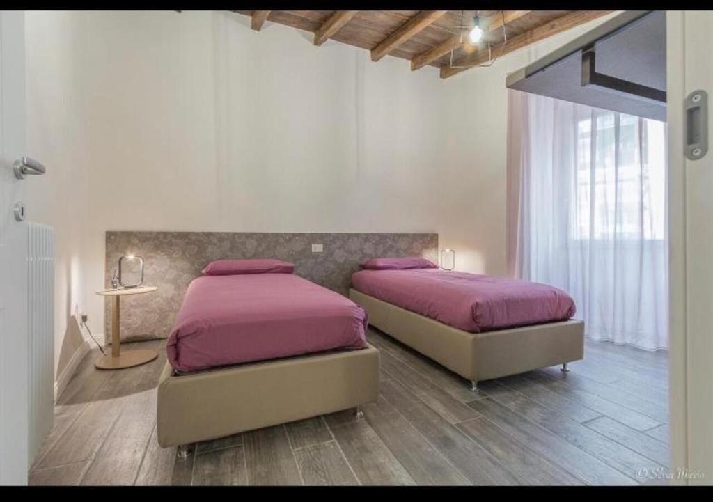 A bed or beds in a room at SDL luxury home Al Pavone