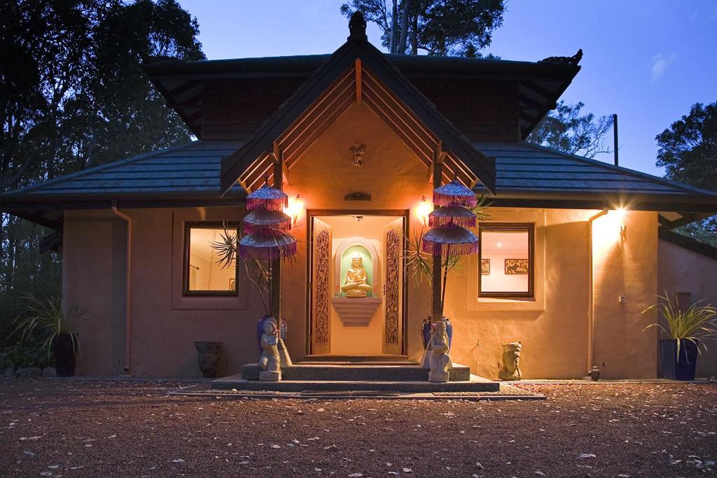 a house with lights on the front of it at Riveresque in Margaret River Town