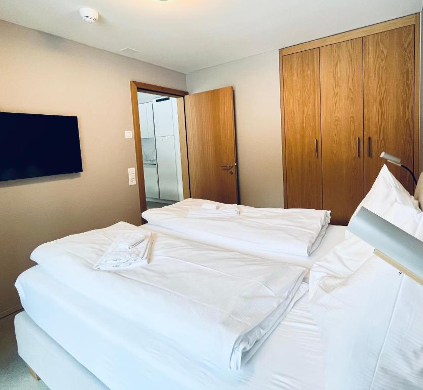 Postel nebo postele na pokoji v ubytování Ferienwohnung Stenna SELVA direkt bei Bergbahnen Skipiste