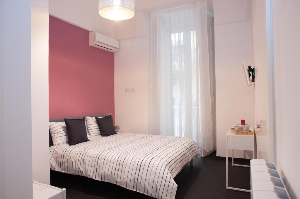 A bed or beds in a room at San Liborio bed and breakfast