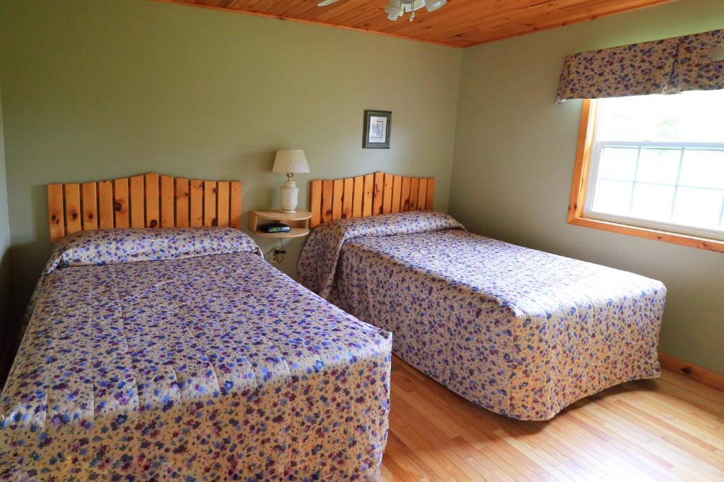 Postel nebo postele na pokoji v ubytování Cavendish Country Inn & Cottages