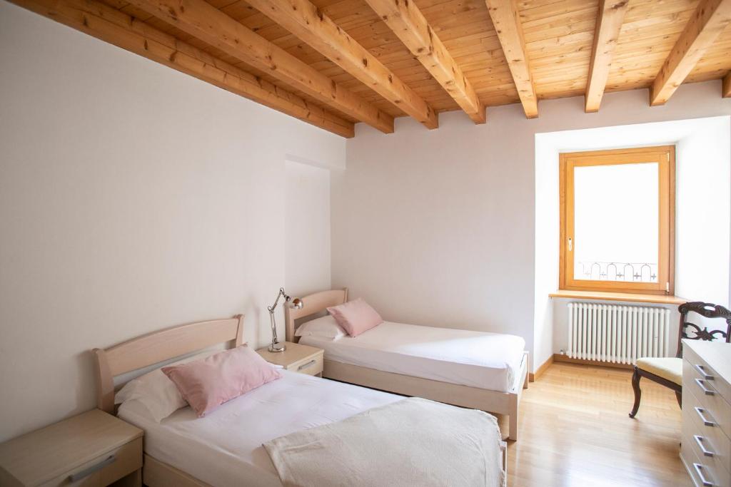 Postel nebo postele na pokoji v ubytování IseoLakeRental - Casa del Pescatore