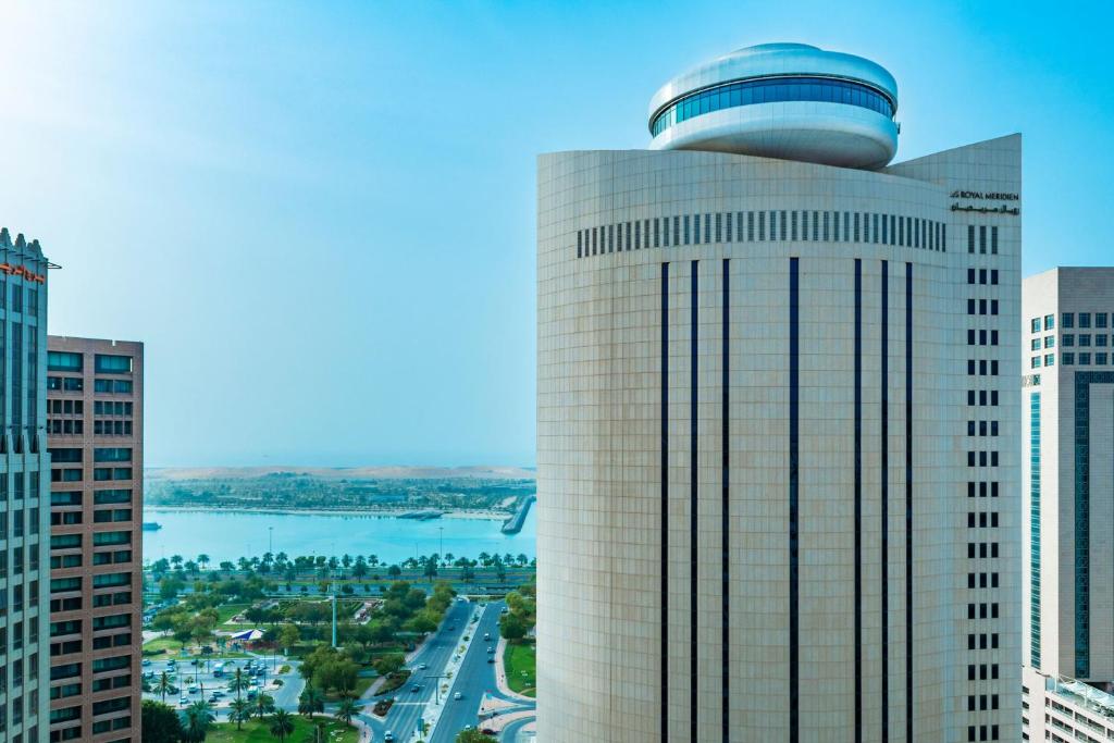 a tall building with a dome on top of it at Le Royal Meridien Abu Dhabi in Abu Dhabi