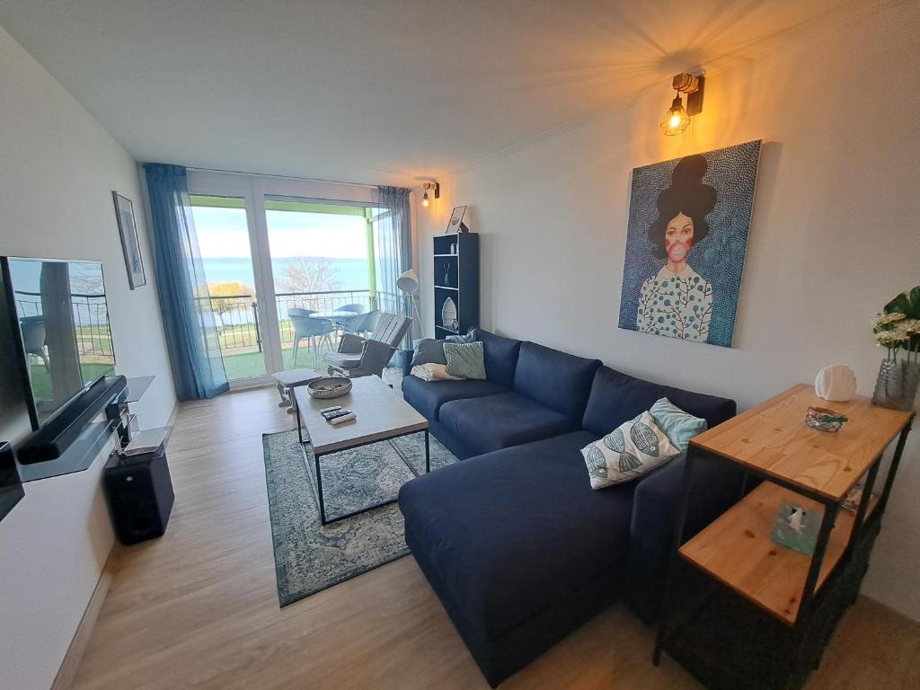 Televízia a/alebo spoločenská miestnosť v ubytovaní Silver Coast Apartman