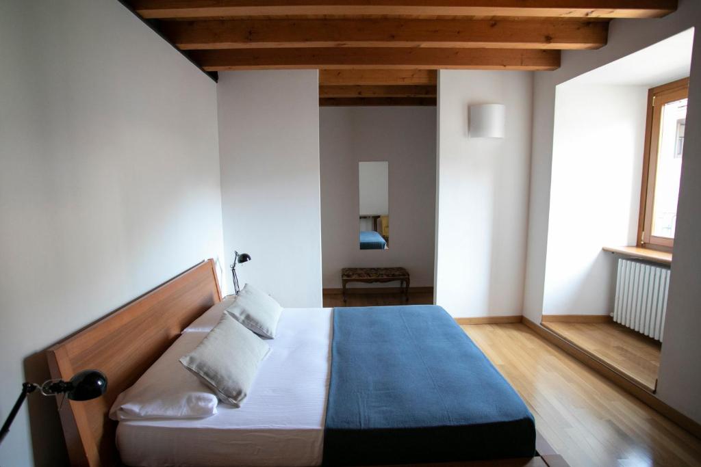 Postel nebo postele na pokoji v ubytování IseoLakeRental - Casa del Pescatore