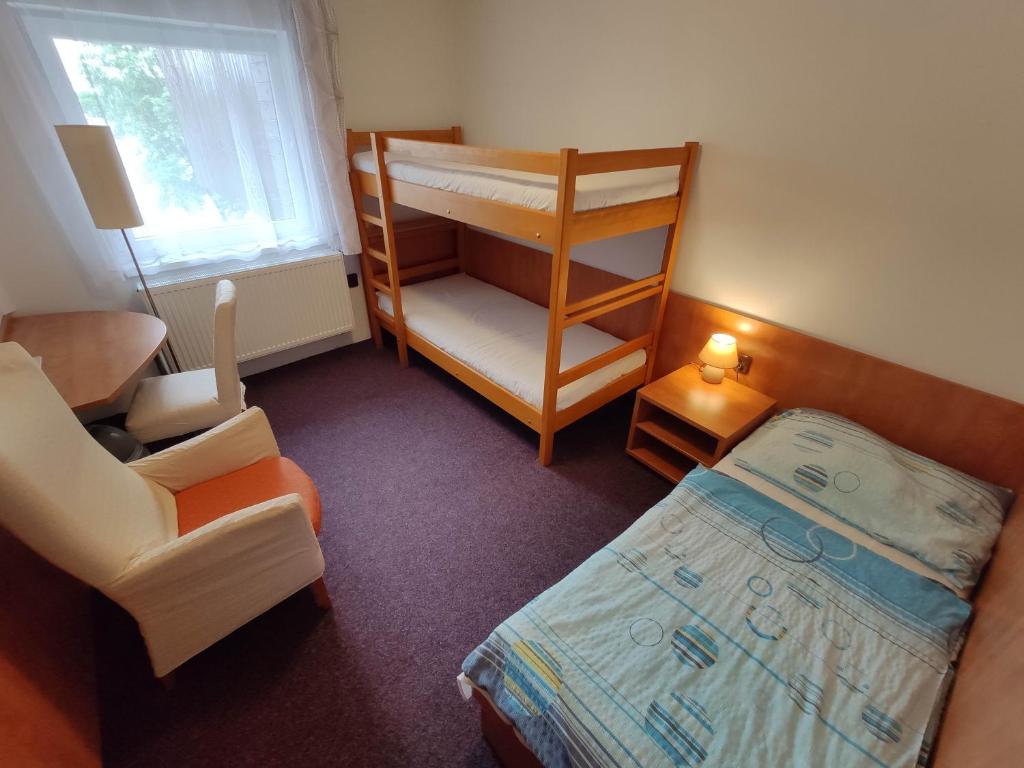 Postel nebo postele na pokoji v ubytování Penzion Aktiv