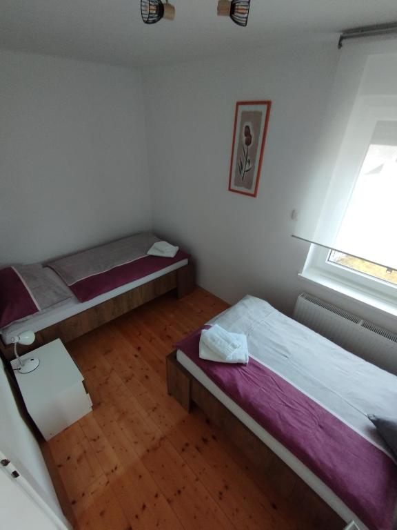 Postel nebo postele na pokoji v ubytování Apartments Justin