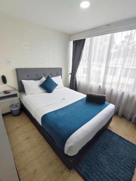 Postel nebo postele na pokoji v ubytování Hotel CGH Bogota Airport