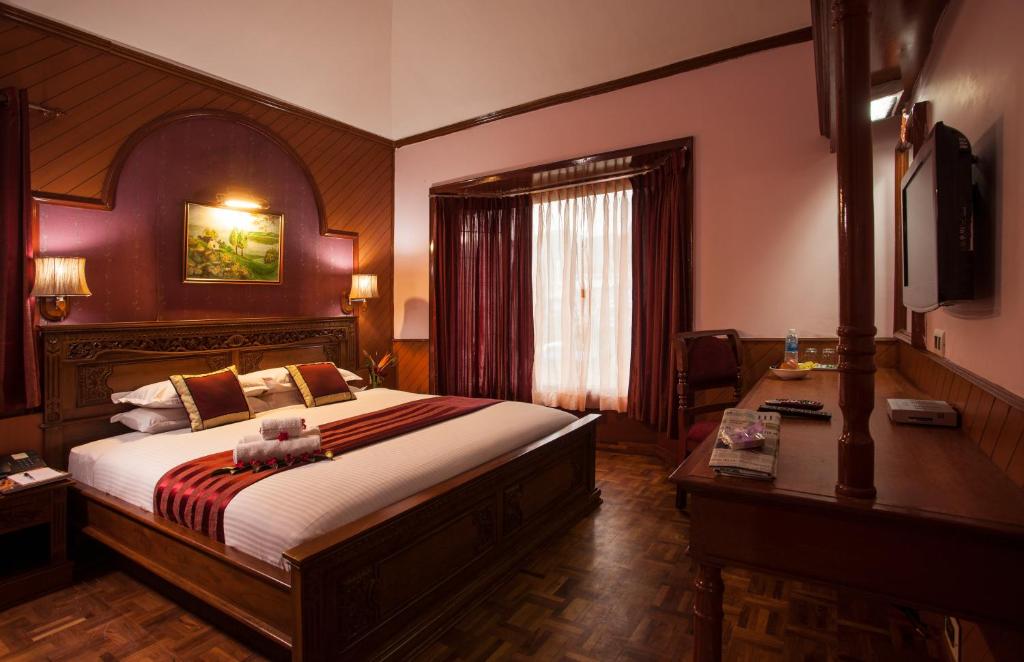 Postel nebo postele na pokoji v ubytování JC Residency