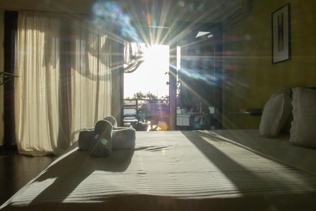 Postel nebo postele na pokoji v ubytování Tajo VIllas