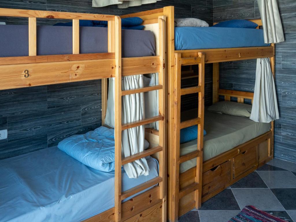 a bunk bed room with three bunk beds in it at My Hostel in Dahab - Dive center in Dahab