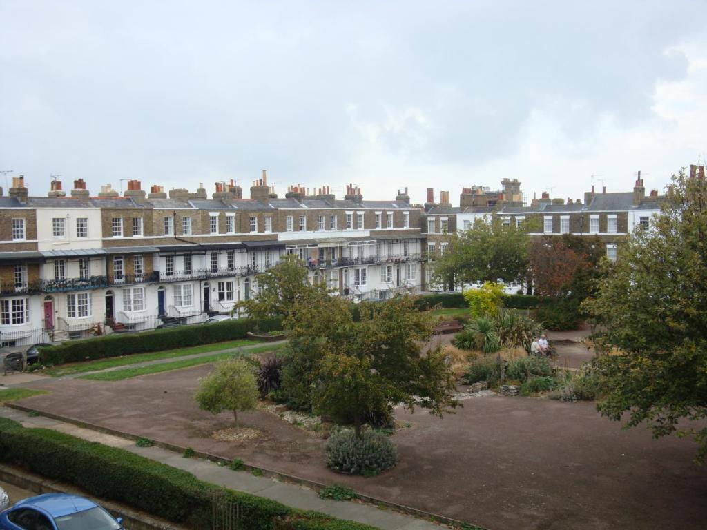 a row of houses in a city with a courtyard at Spencer Court in Ramsgate