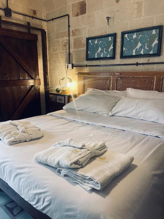 Postel nebo postele na pokoji v ubytování Oria Lofts