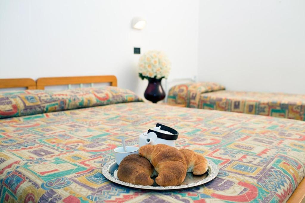 Postel nebo postele na pokoji v ubytování Albergo Villa Marchese