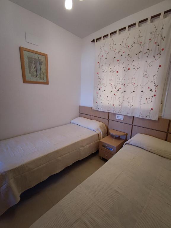 Postel nebo postele na pokoji v ubytování Apartamento acogedor en Magic World, Torre la Sal