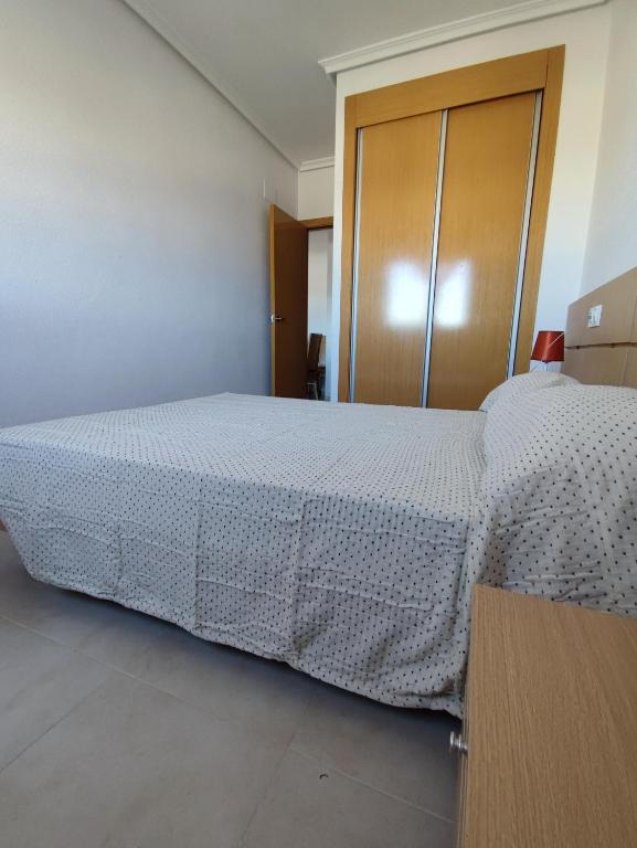 Postel nebo postele na pokoji v ubytování Apartamento acogedor en Magic World, Torre la Sal