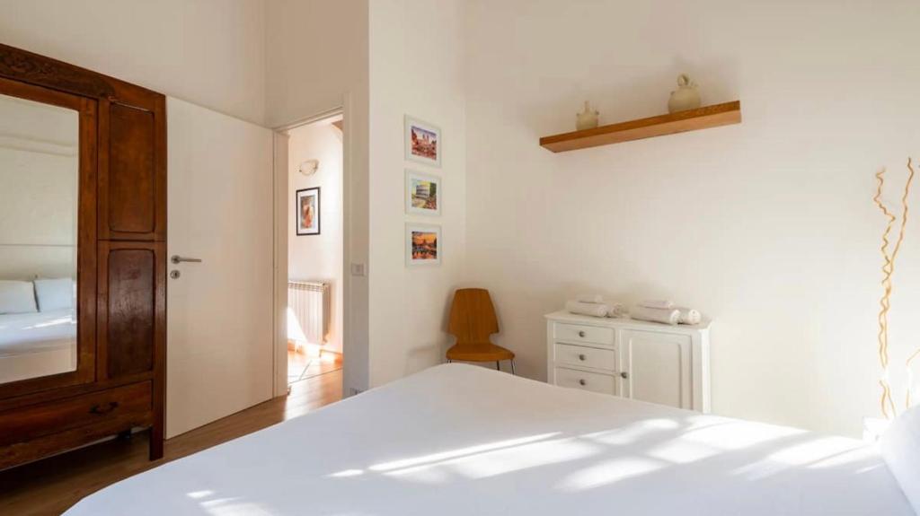 Postel nebo postele na pokoji v ubytování Independent House with Private Patio in Rome