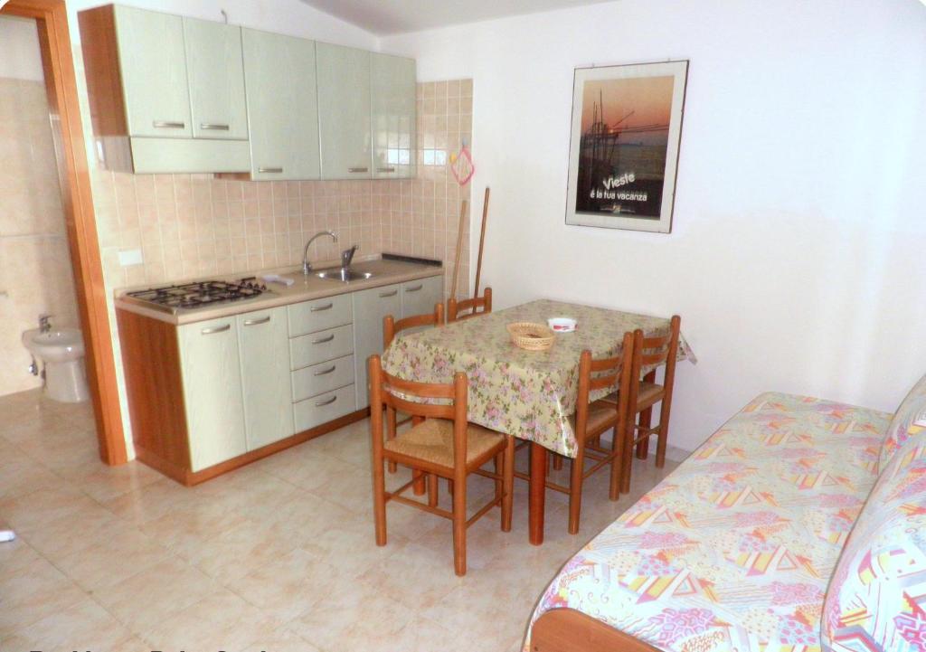 Кухня или мини-кухня в Residence Palm Garden
