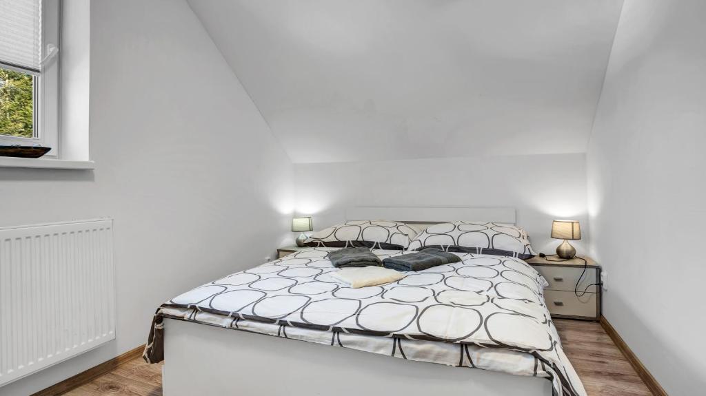 Postel nebo postele na pokoji v ubytování Apartmány Čtyřlístek