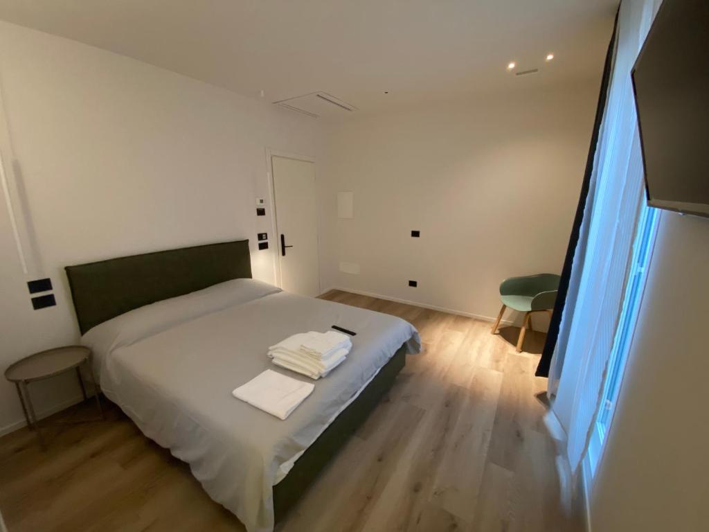 Postel nebo postele na pokoji v ubytování Prato della Valle Apartments