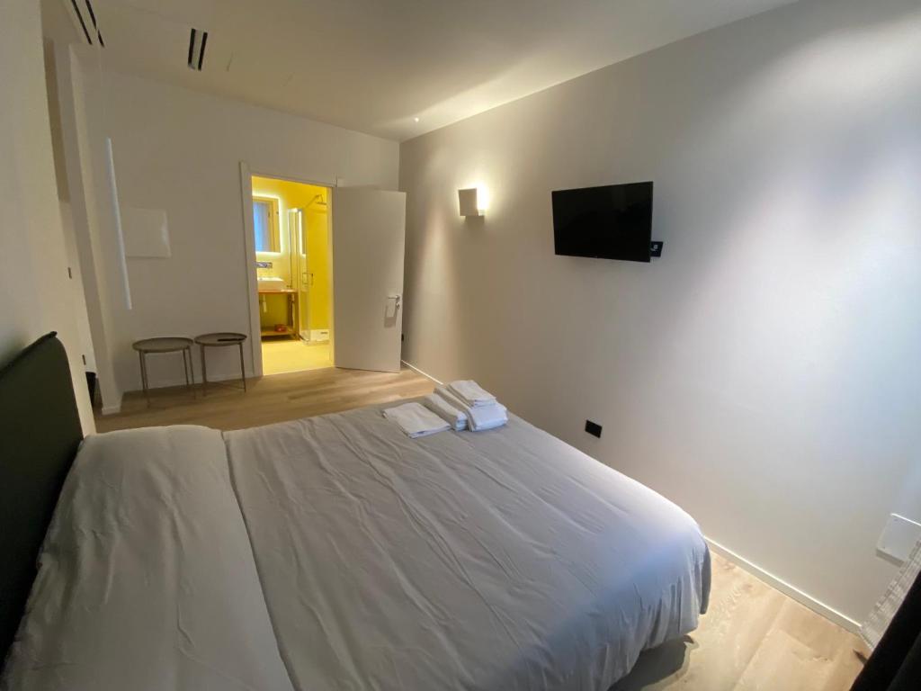Postel nebo postele na pokoji v ubytování Prato della Valle Apartments